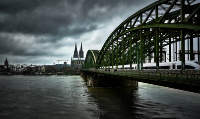 Cologne embankment, view view of the bridge and the cathedral, before a thunderstorm.