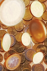 Business concept with Euro coins falling from above