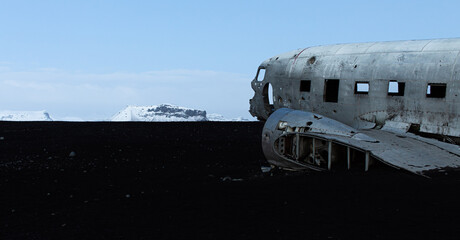 Abandoned old aircraft located on a volcanic black beach in Iceland