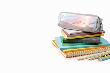 Colorful notepads and pencils on white table with copy space