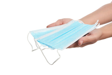 Woman holding disposable face masks on white background, closeup. Protective measures during...