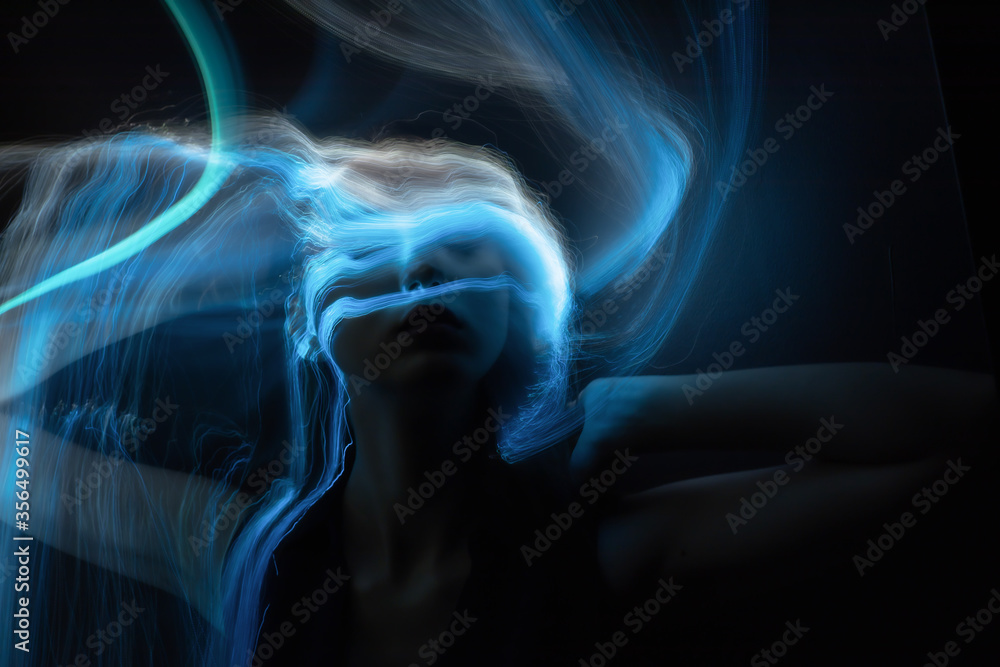 Wall mural lightpainting portrait, new art direction, long exposure photo without photoshop, light drawing at long exposure	
