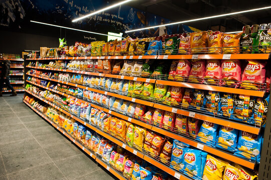 Kiev, Ukraine - September 4, 2019: Silpo supermarket. Chips and snacks on the shelf of a grocery store.
