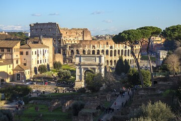 Fototapeta na wymiar Ruins of Roman forum with Colosseum on background , Rome, Italy