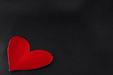 Obraz premium big red hearts on black skin close up of copyspace