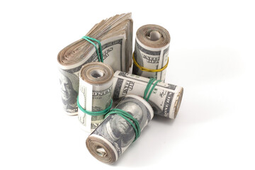 many rolls of money are folded and tied with an elastic band
