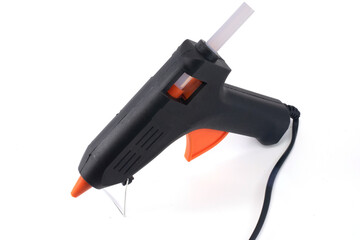 black hot melt gun with hot melt glue isolated