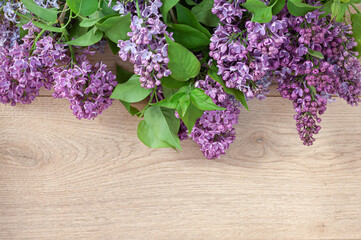 Lilac against the background of wooden boards in rustic style