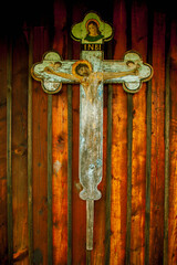 Very ancient wooden destroyed statue of crucifixion of Jesus Christ. Vertical image.