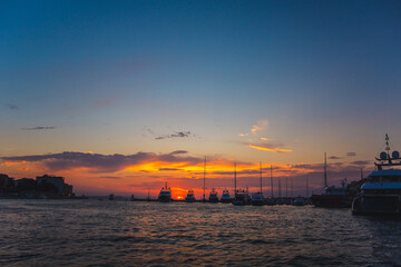 Fototapeta premium Boats during colorful sunset at the harbour in Zadar, Croatia
