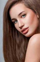 Fototapeta premium Beauty Woman with Long Brown Hair.Gorgeous Hair.Professional Makeup.