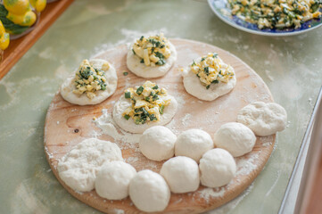 Making pies with onions and eggs.