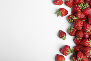 Tasty ripe strawberries on white background, flat lay. Space for text