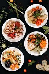 healthy tasty food on a white plate lies on a black background.