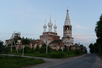 Fototapeta na wymiar Country landscape with old white dome church in summer evening
