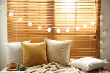 Comfortable place for rest with cushions on window sill
