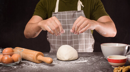 Fototapeta premium A man is baking homemade bakery