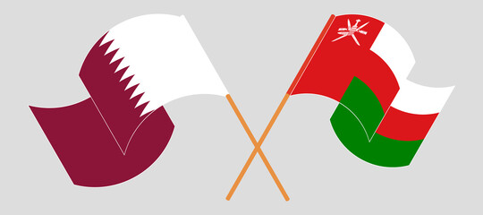 Crossed flags of Oman and Qatar