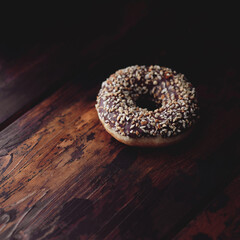 donut with walnut filling lying on the wooden cover