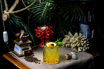 beautiful exotic cocktail with fruits on a beach background