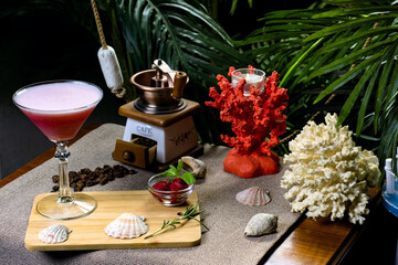 beautiful exotic cocktail with fruits on a beach background