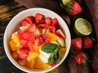 Top view dessert fruits and ice cream cooking homemade with summer fruits assorted on table background.