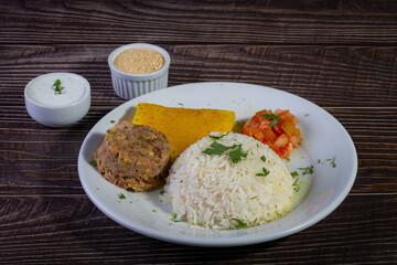 Rice and beans, traditional brazilian dish with manioc and salad.