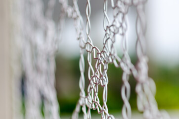 intertwining of metal wires with white sheath to decorate a building. Decorative detail in the shape of a particular mesh net.