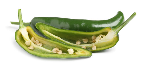 Cut and whole green hot chili peppers on white background