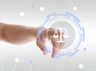 Lawyer touching virtual screen against light background, closeup