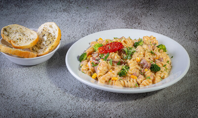 Penne pasta with bechamel sauce and vegetables