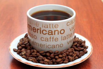 cup of coffee with beans