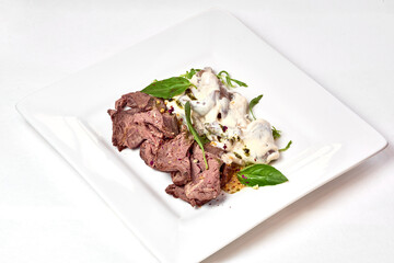 big tasty food lies on white plate on isolate