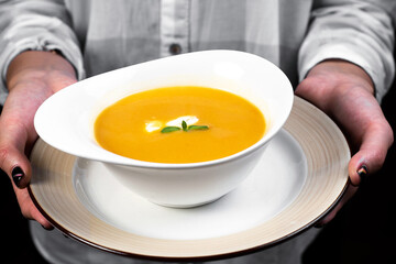 tasty soup in big ceramic plate
