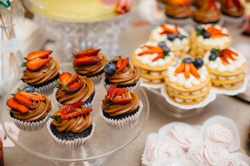 Beautiful and decorated candy bar close-up at a festive Banquet. Sweets close-up