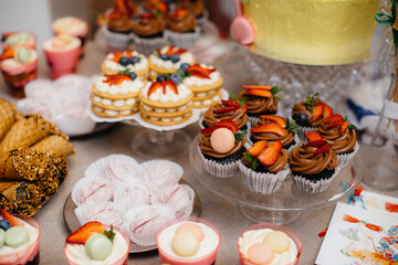 Beautiful and decorated candy bar close-up at a festive Banquet. Sweets close-up