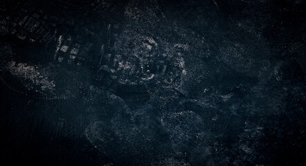 Blue dark wall, stucco, dark concrete. Dark decorative stone. Floodlight. Empty night wall, neon blue light.