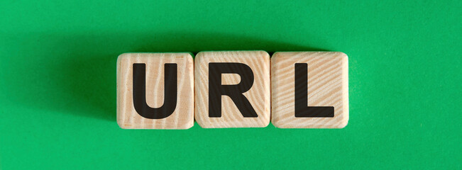 URL website - text on wooden cubes with green background