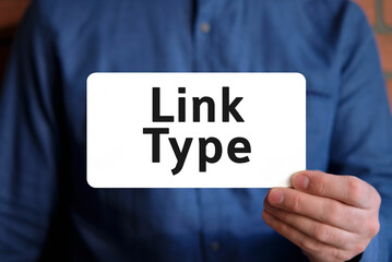 Link type - seo concept in the hands of a young man in a blue shirt