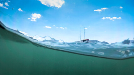Underwater image of yacht on the sea surface