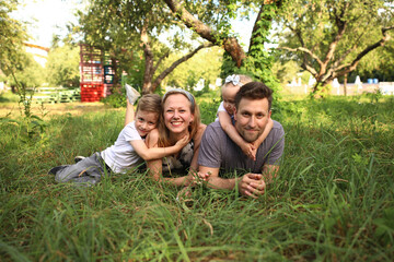 Happy loving family with two children, son and daughter playing and hugging. Family walk. Happy...