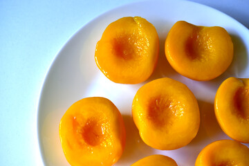 Marinated sliced peaches on a white plate