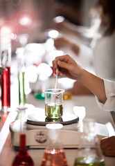 Test tube in the lab close up. A hand doing research with test tube. glassware Test tube in the lab close up. A hand doing research with test tube. glassware