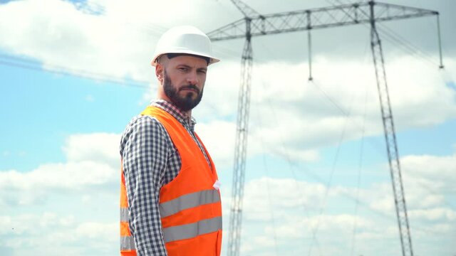 Engineer working near transmission lines. Engineer working near transmission lines