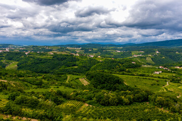 The view from the heights of the mountains, fields, and vineyards of the Italian foothills of the Alps