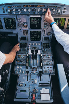 Pilots working in cockpit during flight