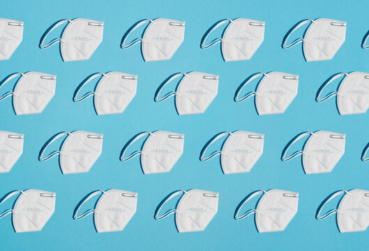 collage of masks for protection factor KN95 on a blue background zenith view