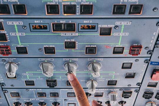 Pilot working with control console during flight