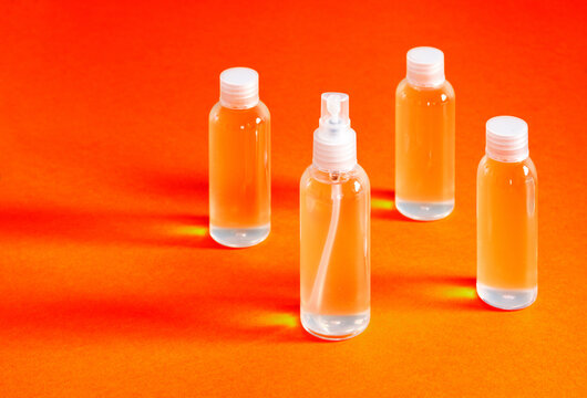 misaligned top view of various clear bottles with hydrochloric gel for filling serves to disinfect the hands of covid-19
