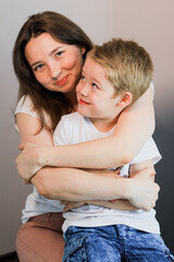 A mother hugs her child.